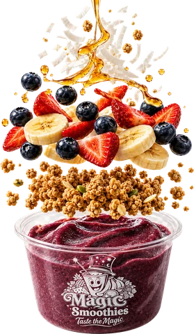 Açaí bowl with granola, banana, strawberries, blueberries, coconut and a honey drizzle